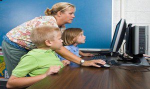 mother with children on computer
